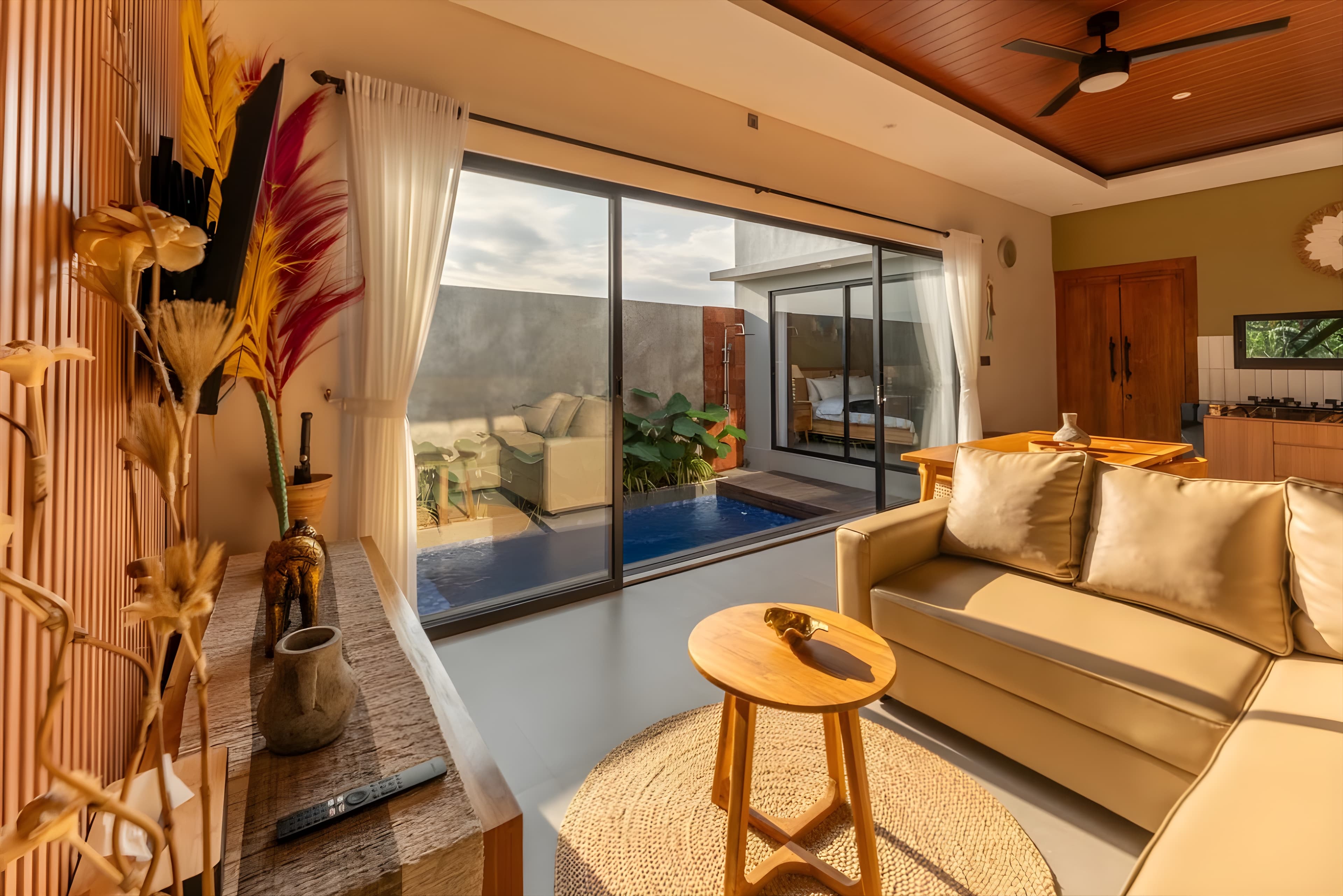 Villa Sattvika living area with pool view