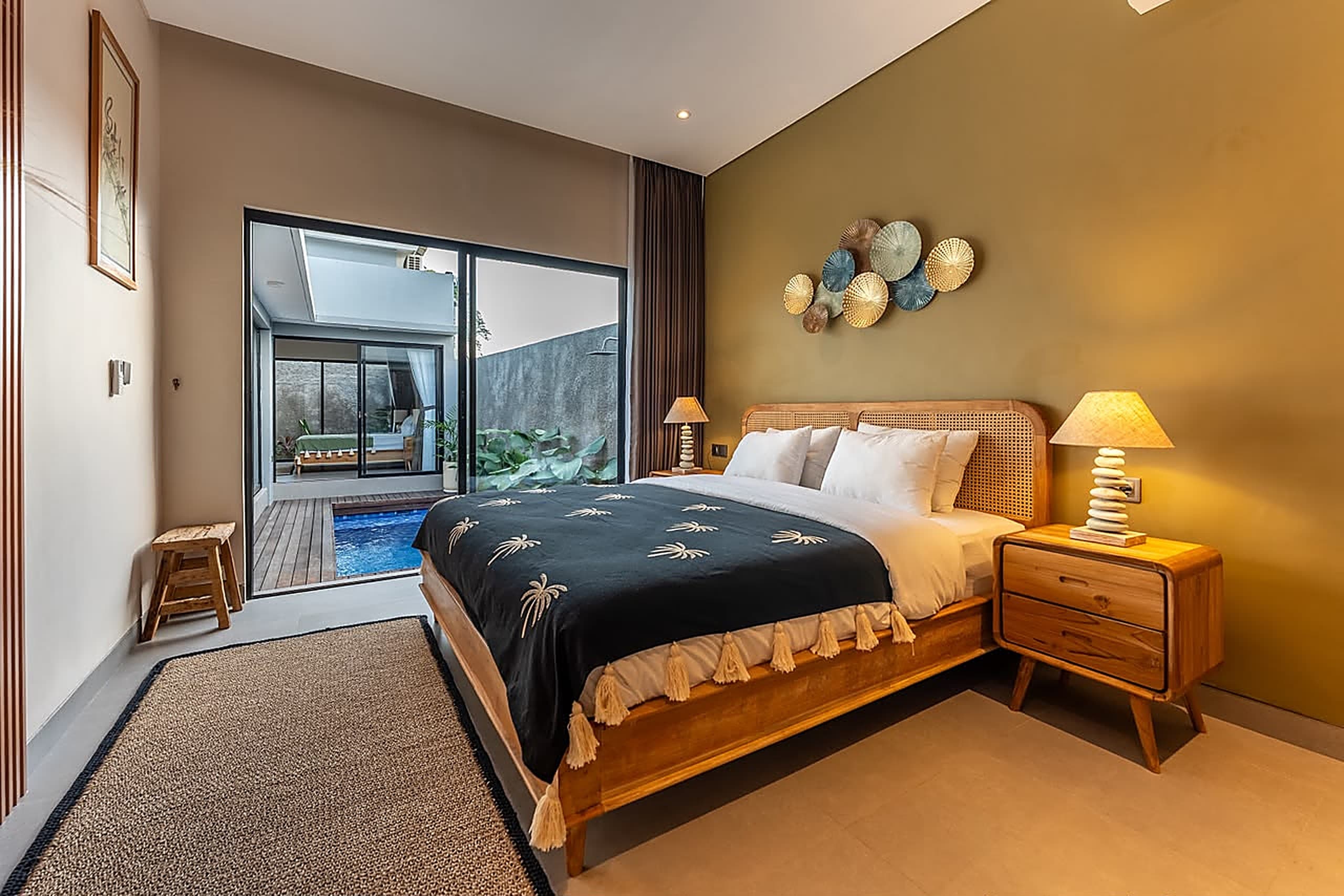 Bedroom suite with cane headboard and ensuite vanity