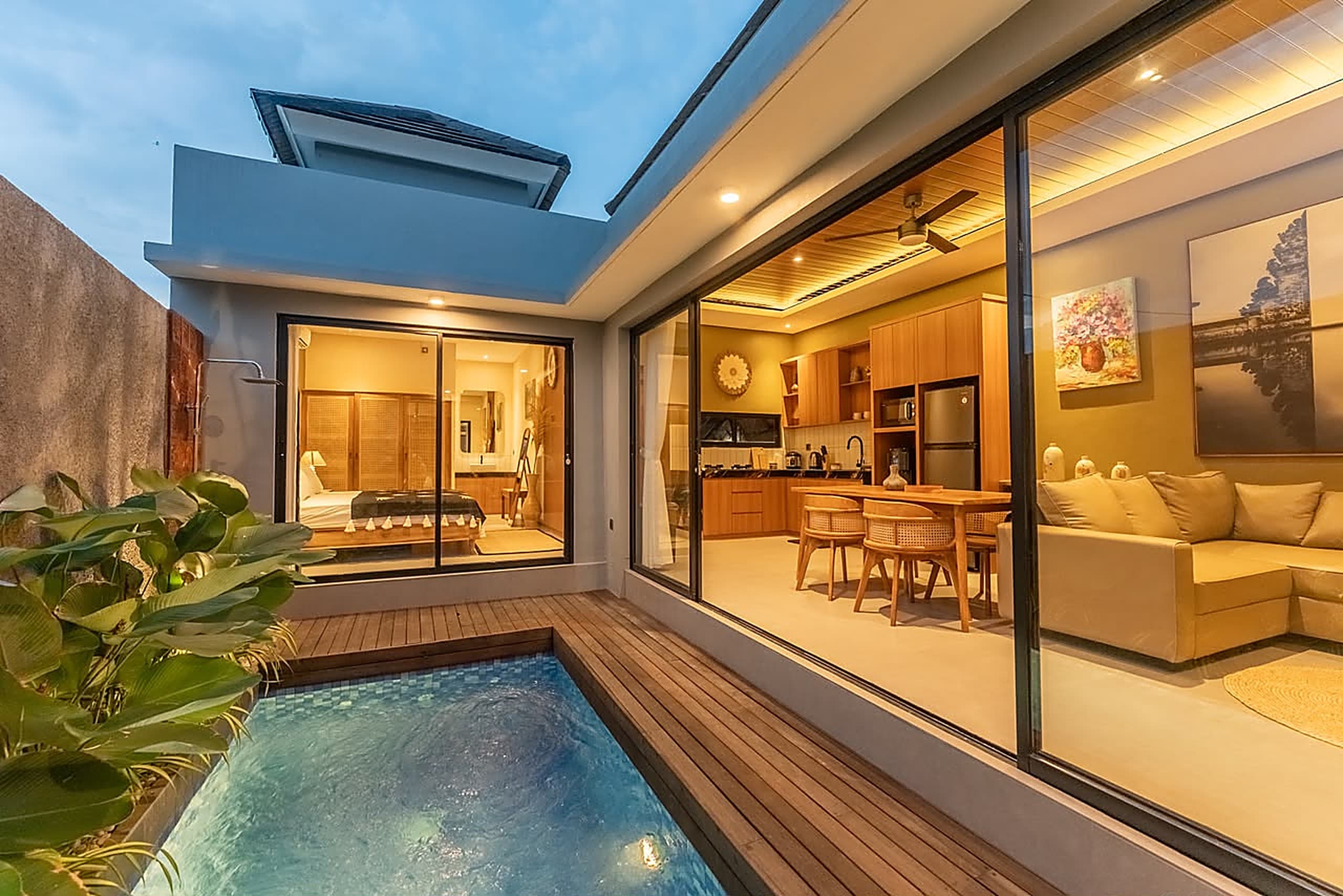 Twilight view of Villa Sattvika ' s private pool and teak deck